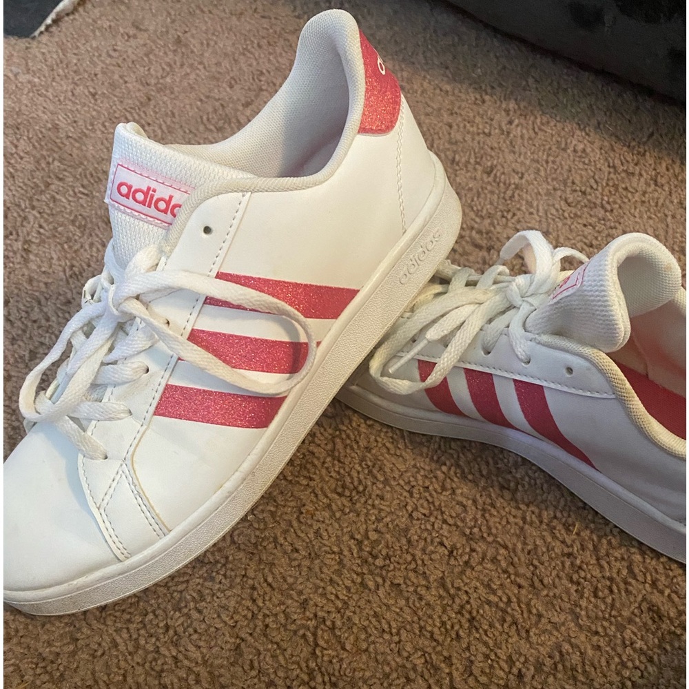 Women’s size 5 Adidas white with hot pink glitter stripes only worn a few times.